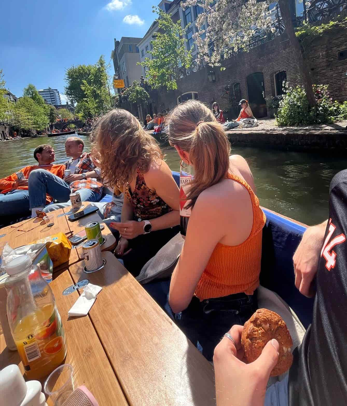 The boat cruising down a scenic Utrecht canal